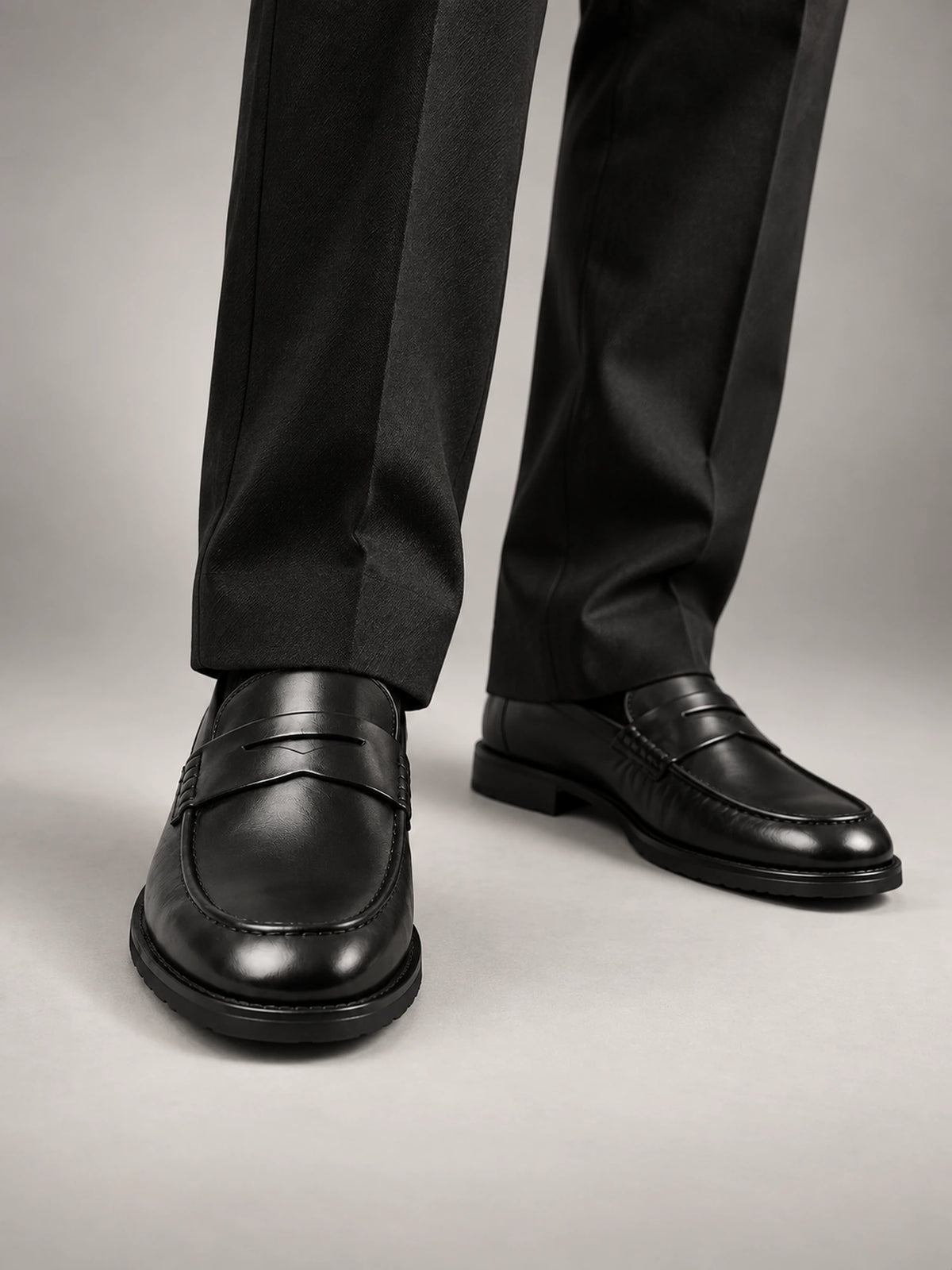 Men's Leather-Look Chunky-Sole Penny Loafers in Black — front view
