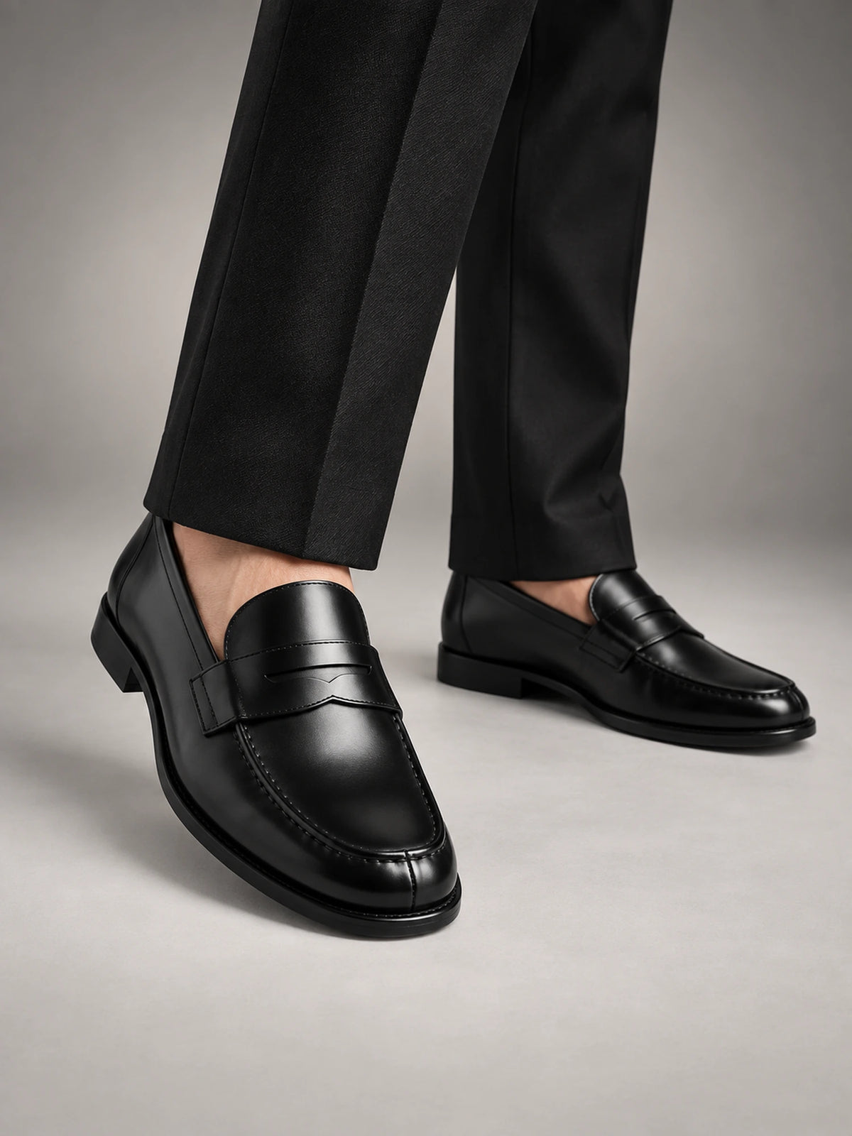 Men's Leather Slip-On Penny Loafers in Black — front view