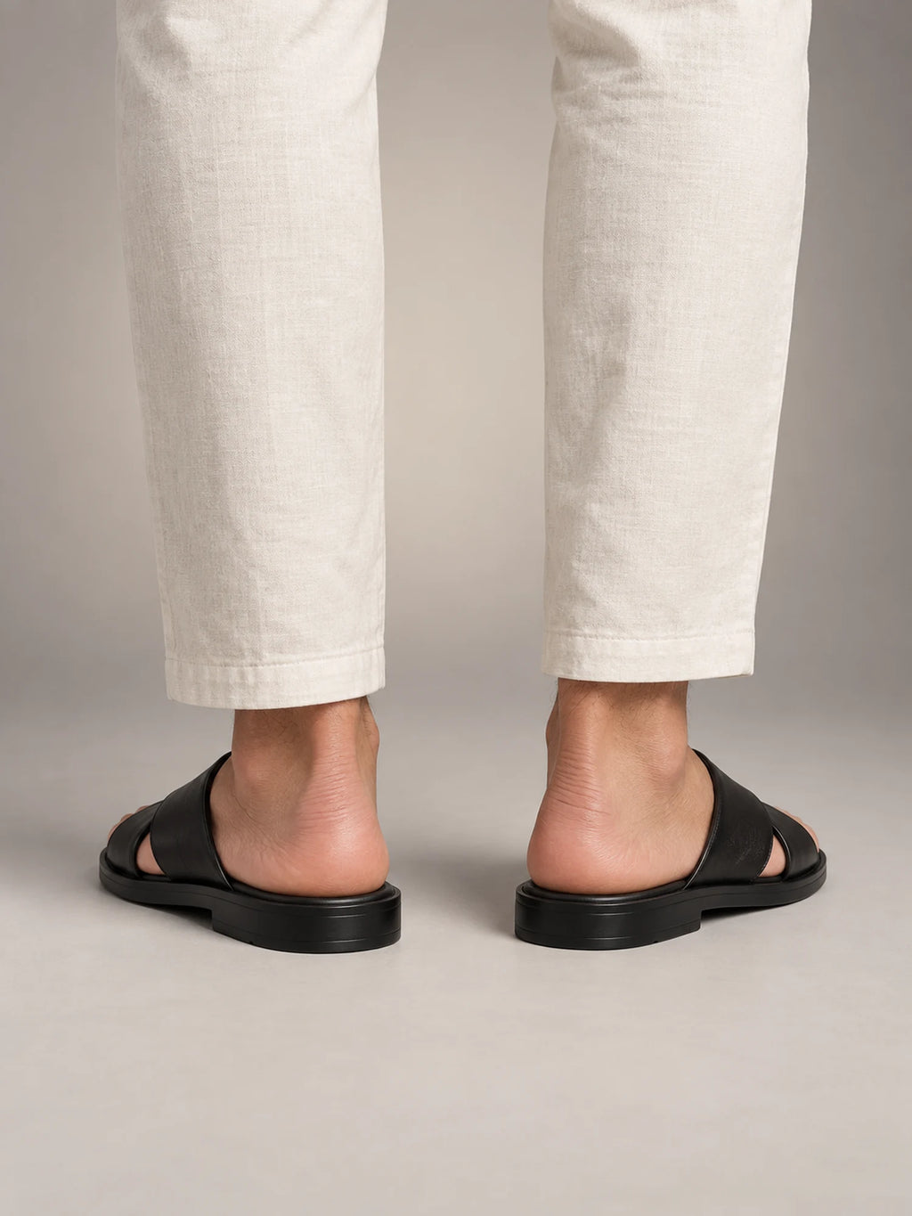 Volantero Men's Slide Sandals with Cross Strap Design in Black, back view